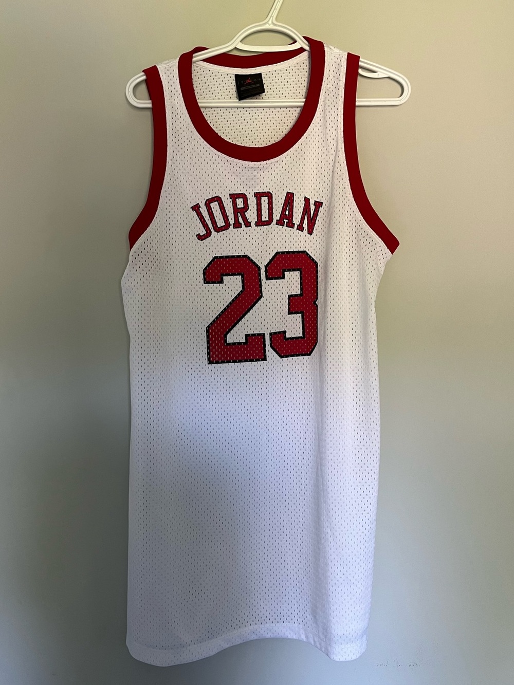 Jordan White Jersey with Red Accents and Black Label
